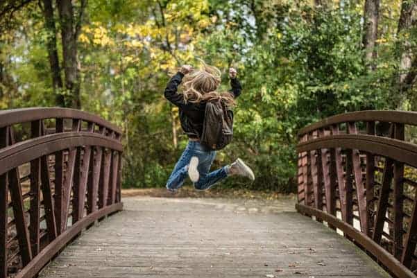 happy kid on bridge
