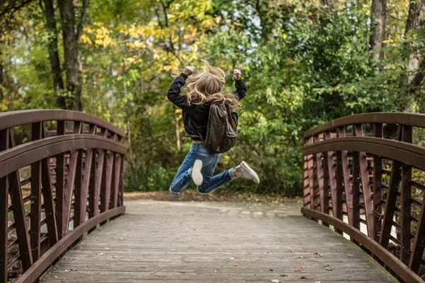 happy kid on bridge